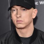 Eminem attending a major entertainment event in a black suit, happy gilmore 2 cast eminem