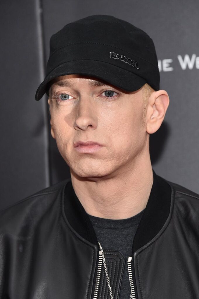 Eminem attending a major entertainment event in a black suit, happy gilmore 2 cast eminem